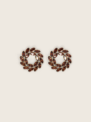 Gold plated stud earrings with brown marquise and round-cut stones in a wreath-style circular design on a neutral background