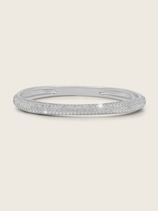 Christy pavé bangle with sterling silver base and premium White Gold plating, set with CZ stones on a neutral background