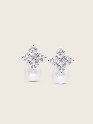 Crystal Hydrangea Earrings with Shell Pearl featuring intricately cut CZ petals and a luminous shell pearl drop, crafted in sterling silver with white gold plating, displayed on a clean white background.