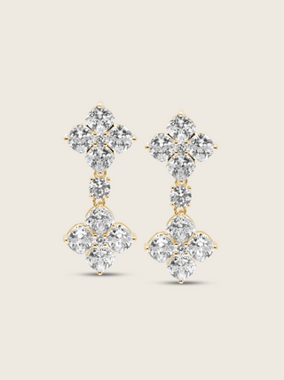 The Double Crystal Drop Hydrangea Earrings featuring two sparkling CZ stones linked by a delicate connecting stone, set in sterling silver with gold plating, displayed on a clean white background.