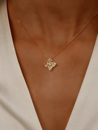Close-up of model wearing White Gold Crystal Hydrangea Necklace in Lemon Drop, showing CZ flower detail