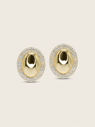 Gold plated Gigi Oval stud earrings with sparkly CZ stones around the outside, perfect for formal occasions and events, shot on a neutral background