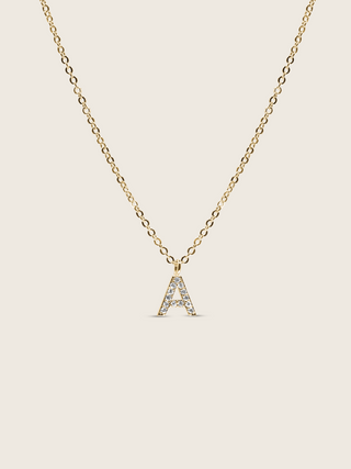 Customisable gold plated initial necklace with cubic zirconia A charm on a delicate chain, matching the Love Letter bracelet design