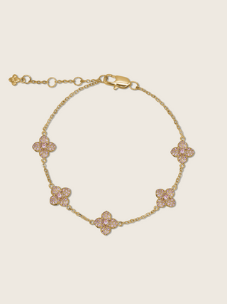 Gold plated bracelet with five light pink cubic zirconia hydrangea charms on fine chain, delicate floral design ideal for soft styling or gift-giving