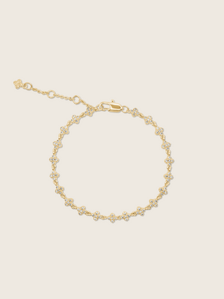 Gold plated pavé bracelet displayed flatly on a white background, highlighting the sparkling detail of the chain bracelet.