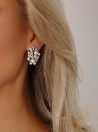 Model wearing Grace earrings featuring freshwater pearls and sparkling CZ stones with premium white gold plating