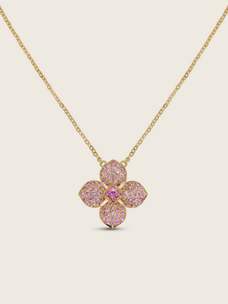 Gold-plated hydrangea pendant necklace with light pink cubic zirconia stones and central embellishment, displayed on white background