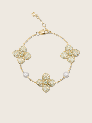 Gold-plated hydrangea bracelet with lemon yellow CZ stones and freshwater pearls, displayed on plain background