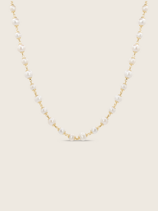 Gold-plated Margot necklace featuring alternating freshwater pearls on fine chain, displayed on white background