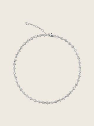 Micro hydrangea pavé necklace in white gold plated, displayed flatly on a white background, showcasing the intricate design and sparkling details of the piece.
