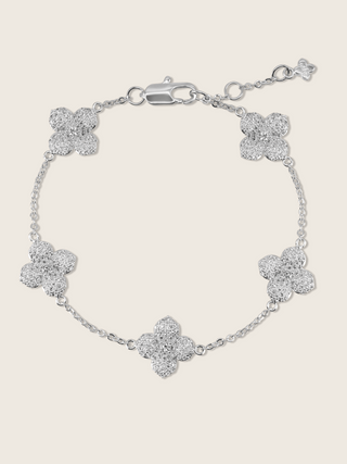 Multi Midi Hydrangea bracelet in premium White Gold plating with five pavé flower charms and adjustable clasp, shown on neutral background