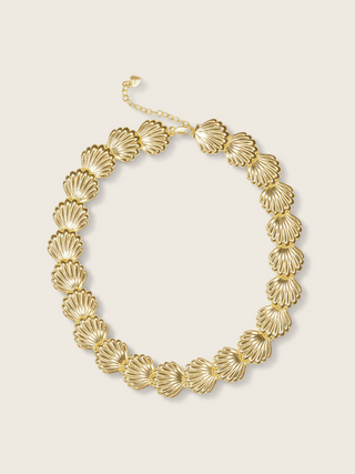 Muriel necklace with shell motif links in 14k gold plating, shown flat against a neutral background
