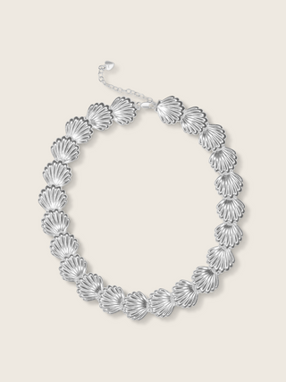 Muriel necklace in premium White Gold plating with sculpted shell shaped links, shown on neutral background