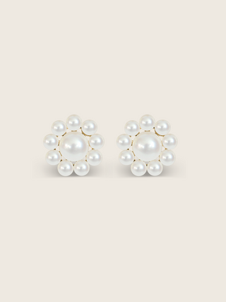 Lustrous pearl stud earrings with gold settings on a clean white background, product detail view