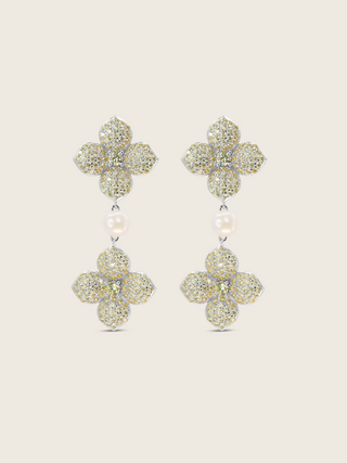 White gold plated hydrangea dangle earrings with yellow cubic zirconia stones and freshwater pearl on white background. Elegant floral drop earrings with sparkly detailing.