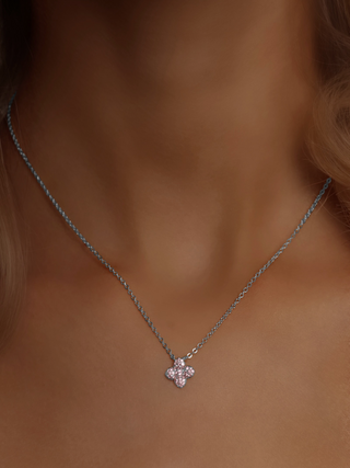 White gold plated mini hydrangea necklace in light pink CZ, worn at the collarbone for a soft, romantic touch - perfect layered or styled solo