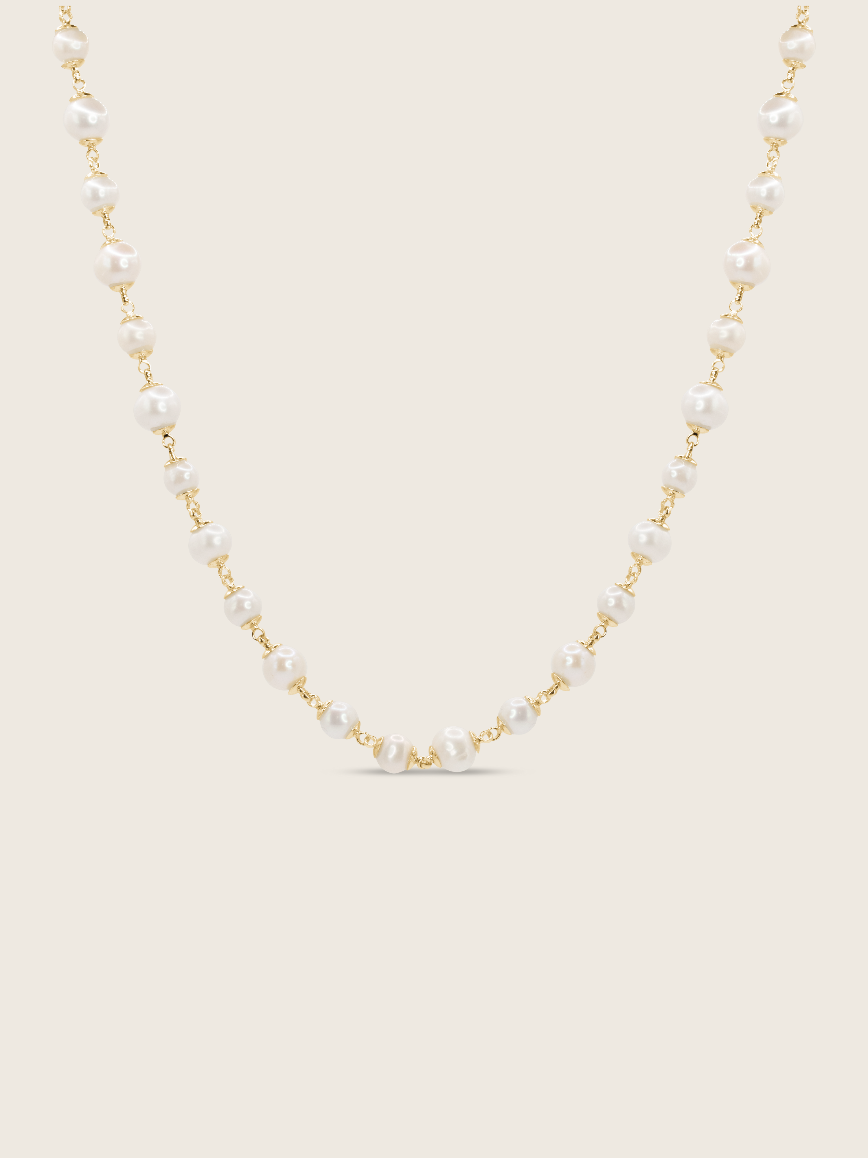 Gold-plated Margot necklace featuring alternating freshwater pearls on fine chain, displayed on white background