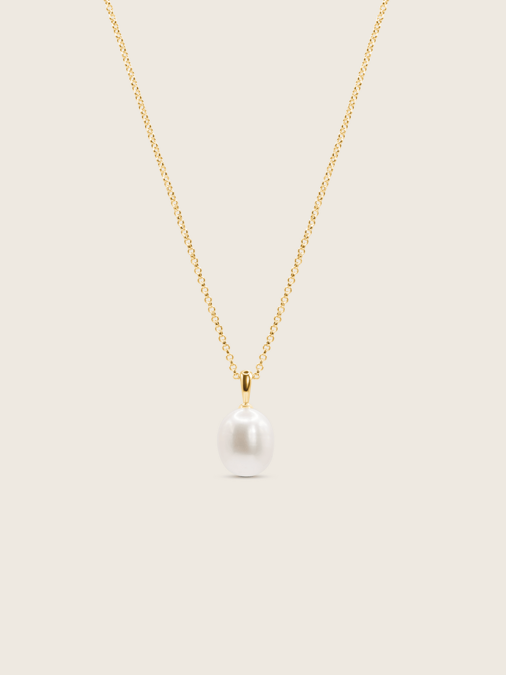 14k gold plated Audrey necklace, with a freshwater pearl and fine gold chain displayed on a neutral background