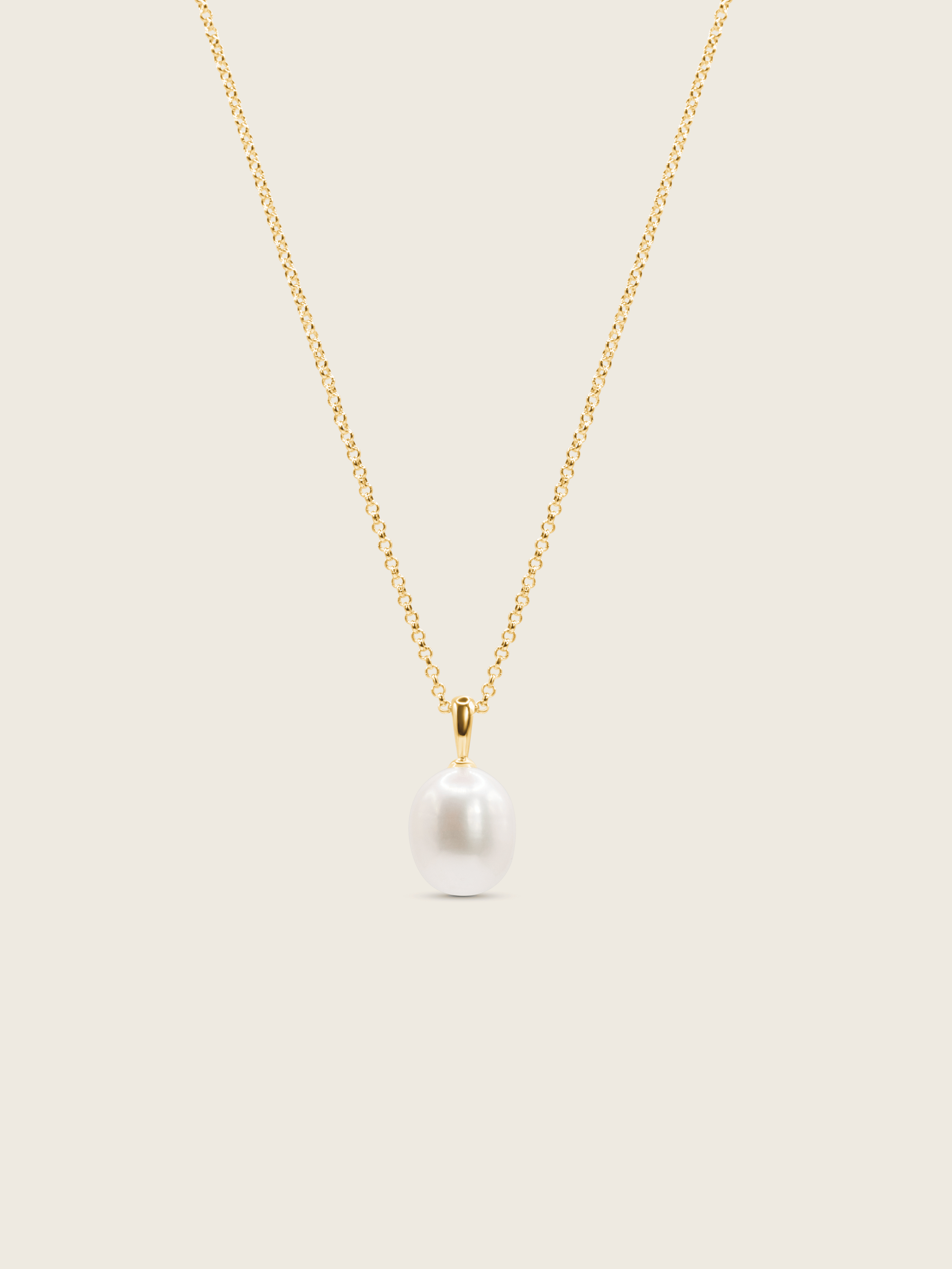 14k gold plated Audrey necklace, with a freshwater pearl and fine gold chain displayed on a neutral background