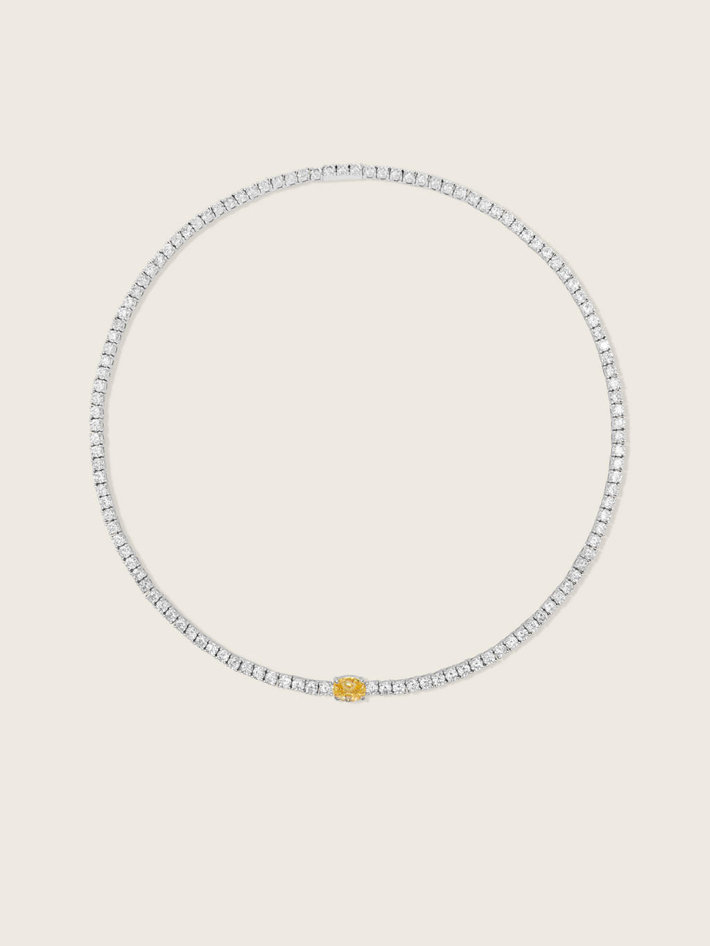 aurelia necklace white gold plated with central yellow oval stone, on a neutral background