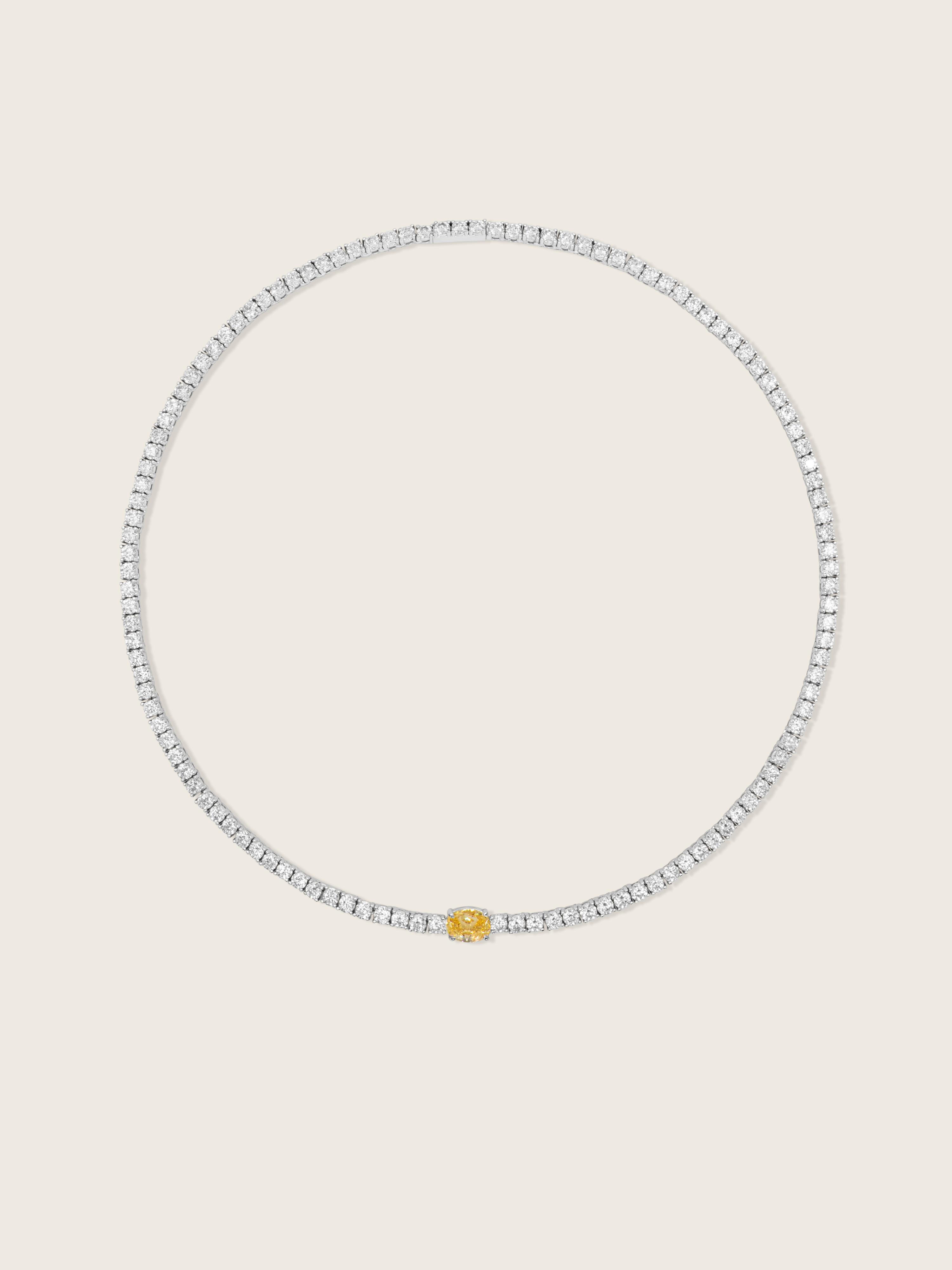 aurelia necklace white gold plated with central yellow oval stone, on a neutral background