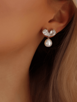 adore-earring-white-gold-plated-model-ear-close-up