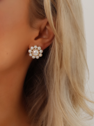 Close-up of sophisticated pearl earring in ear