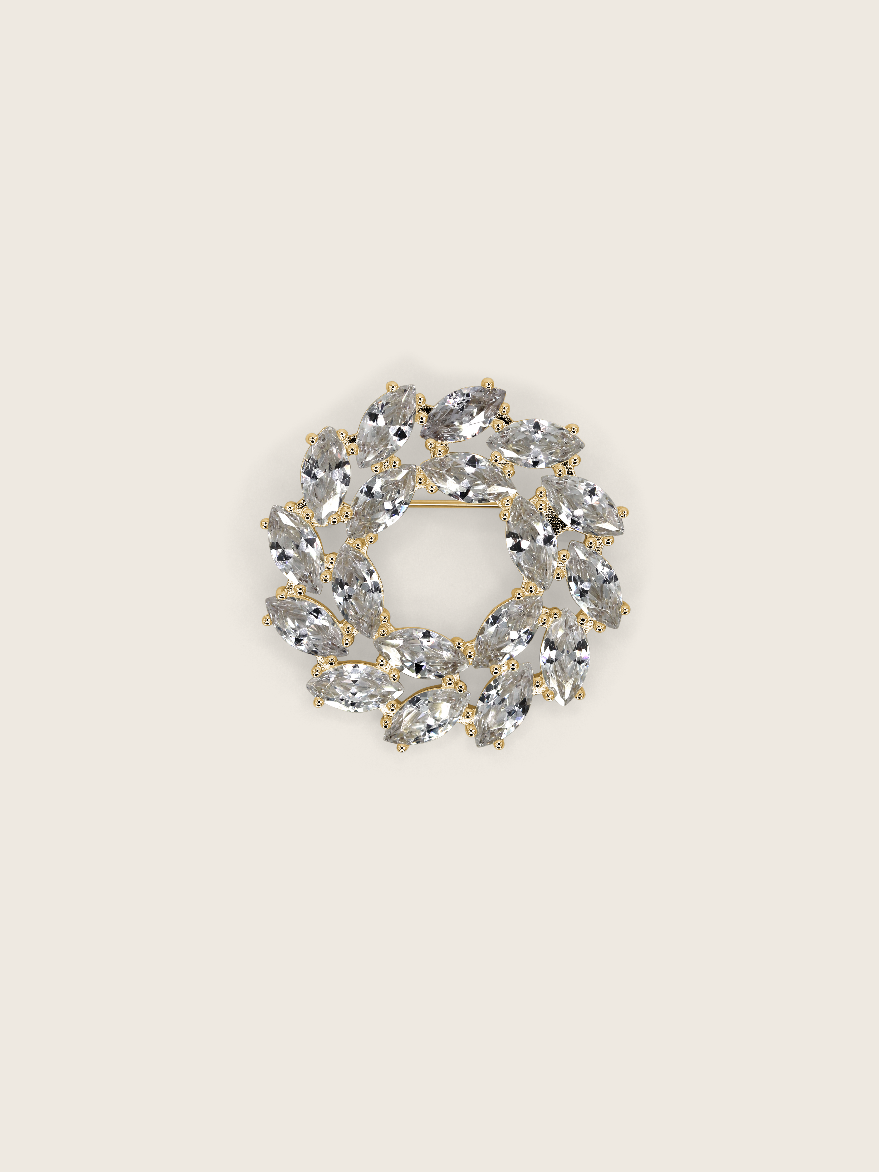 Amanda Brooch in 14k gold plating with clear crystal marquise cut cubic zirconia stones in wreath design, displayed on neutral background
