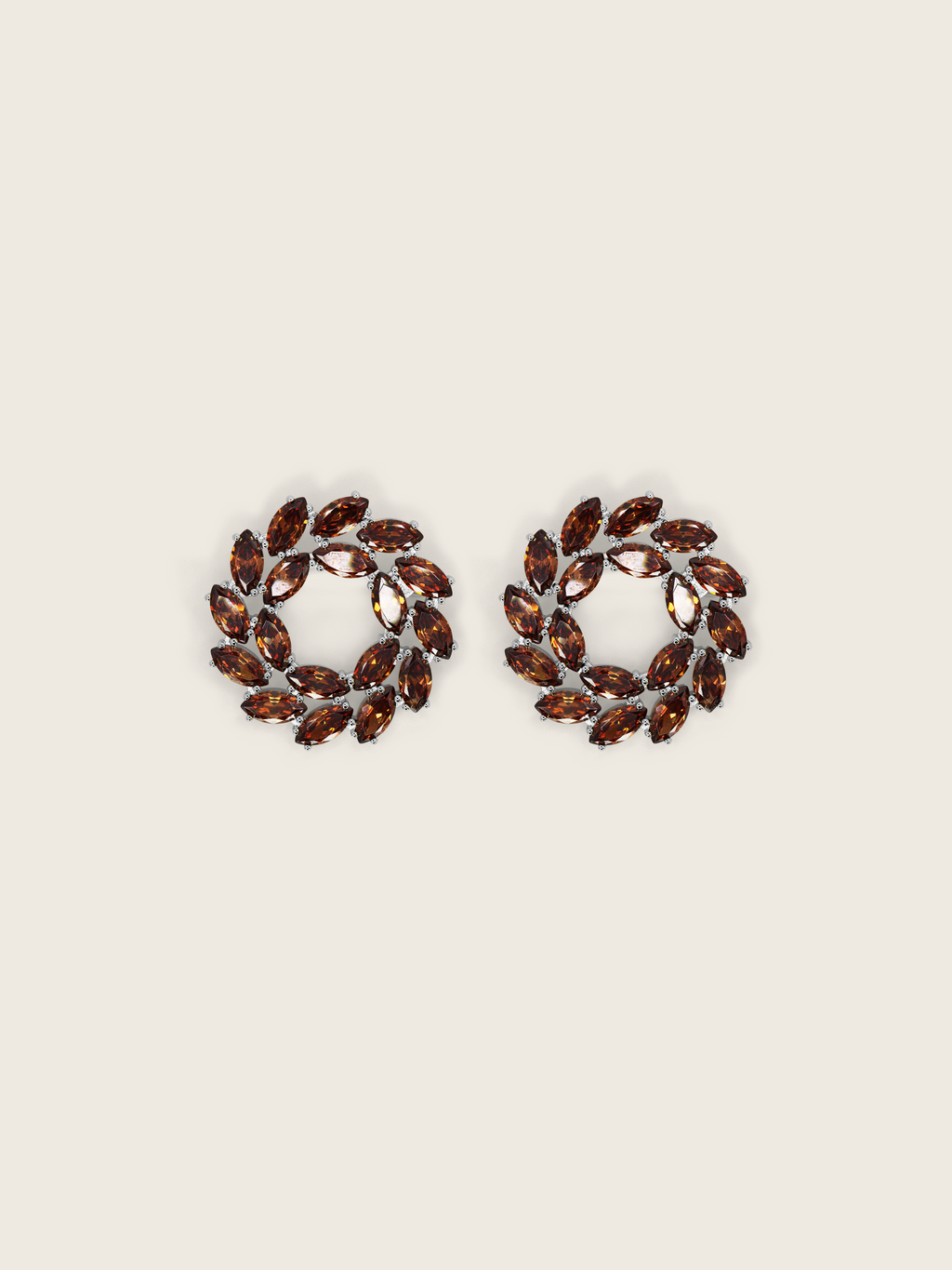 White gold wreath-style stud earrings featuring clustered brown marquise and round-cut stones in a circular silhouette on a neutral background