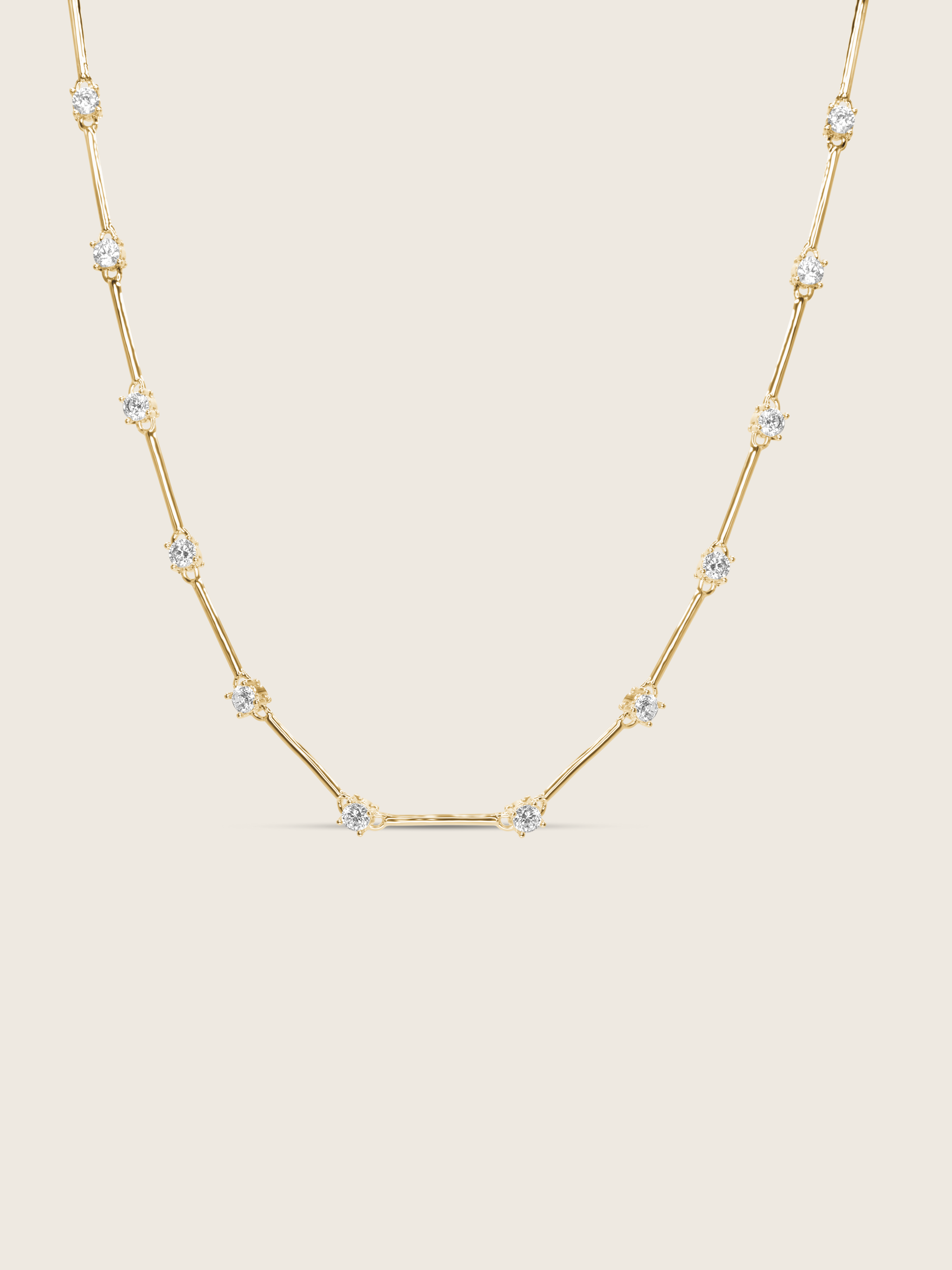 Gold plated Astra necklace with cubic zirconia star details, flat lay on white background
