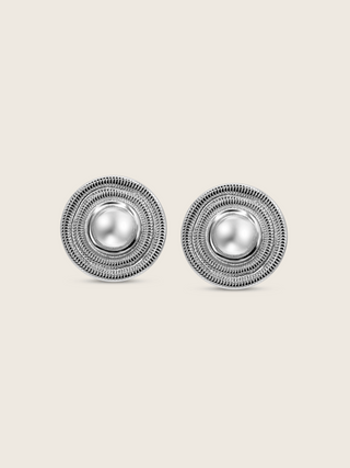 Athena stud earrings in sterling silver with white gold plating, featuring a concentric circle design and raised domed centre, retro-inspired mid-century style jewellery photographed on a white background.