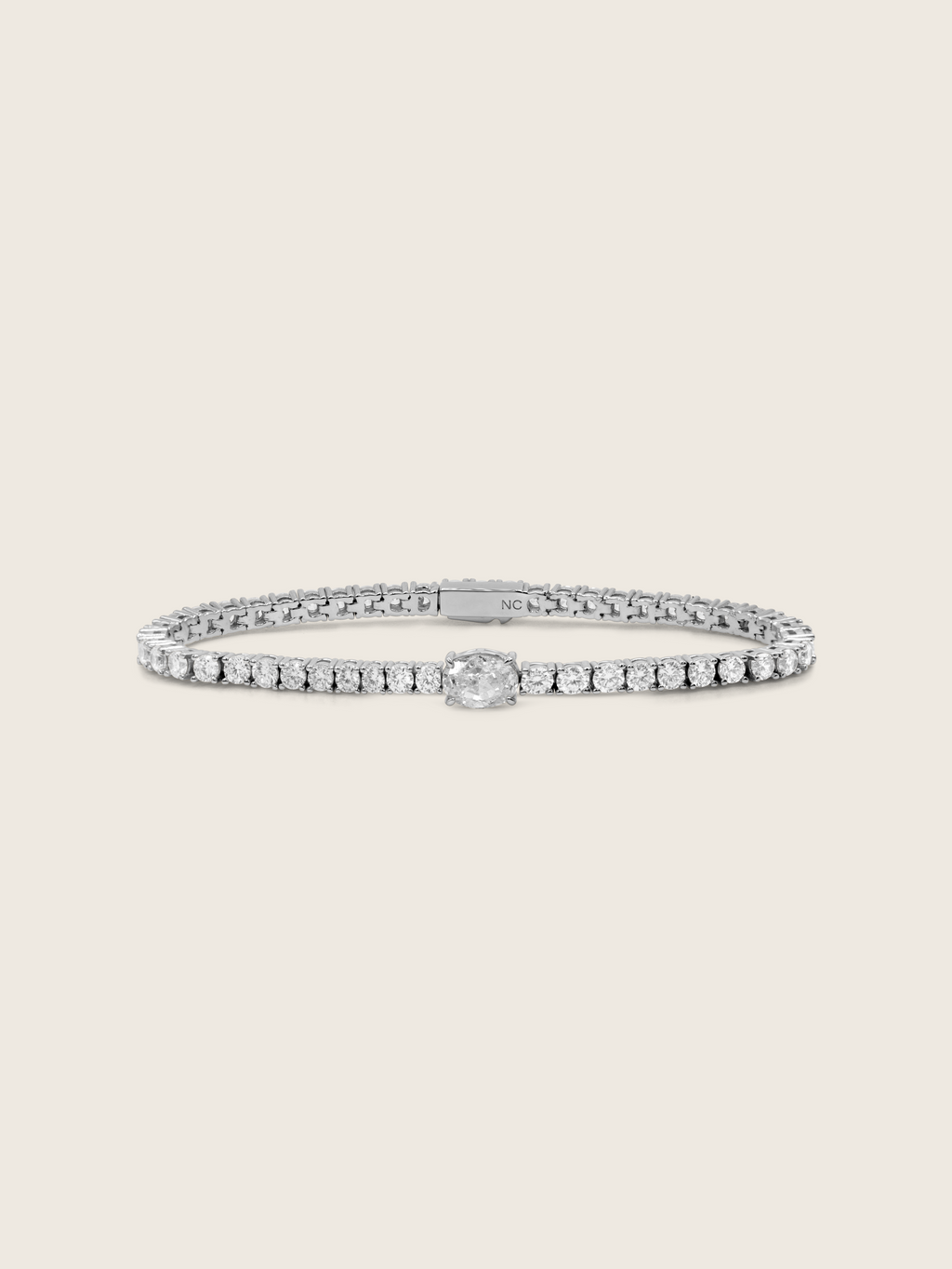 Aurelia white gold plated tennis bracelet with central oval clear CZ and fine crystal detail