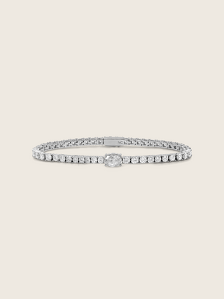 Aurelia white gold plated tennis bracelet with central oval clear CZ and fine crystal detail