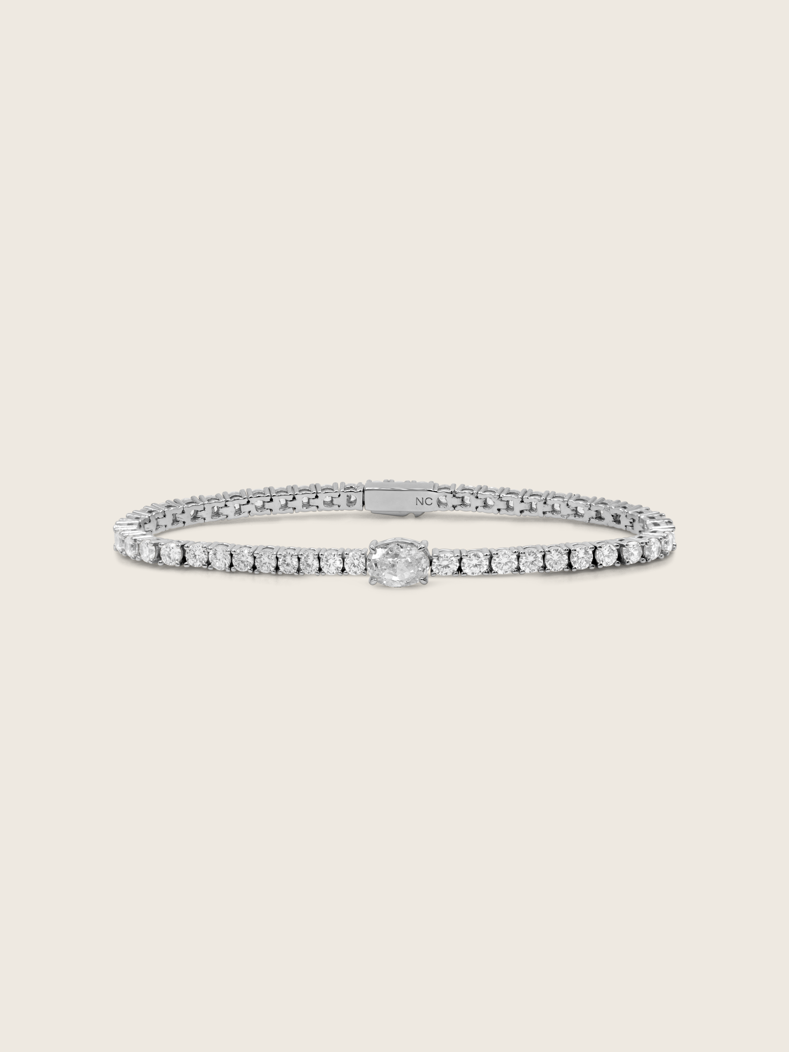 Aurelia white gold plated tennis bracelet with central oval clear CZ and fine crystal detail