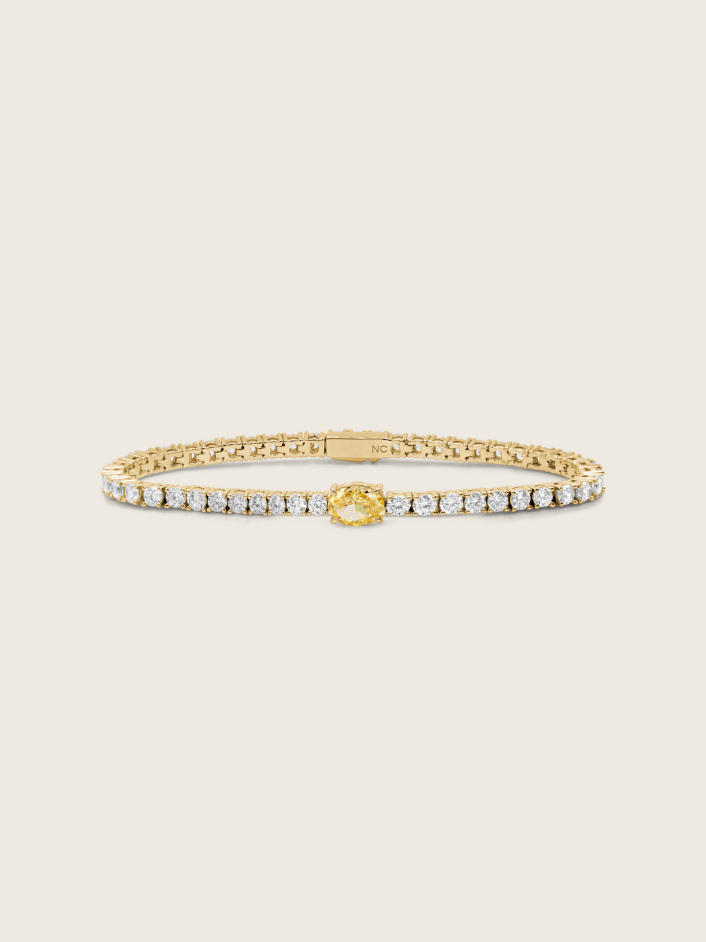 Gold plated Aurelia lemon drop bracelet with yellow oval centre stone and clear CZ for a vibrant, elegant finish