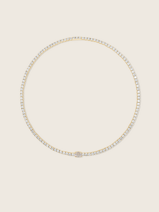 Gold plated tennis necklace with clear CZ stones and a central oval cut crystal for elegant sparkle