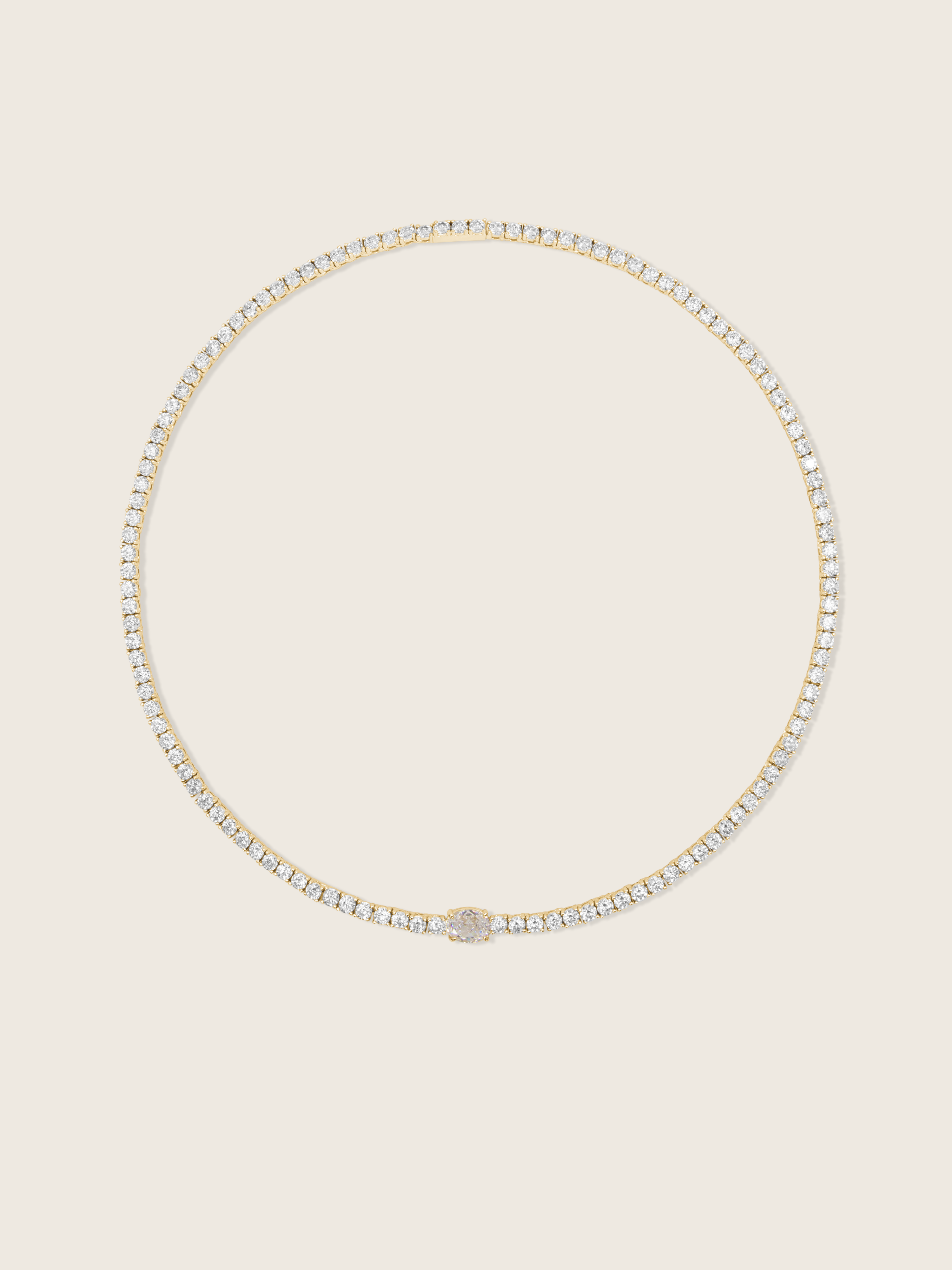 Gold plated tennis necklace with clear CZ stones and a central oval cut crystal for elegant sparkle