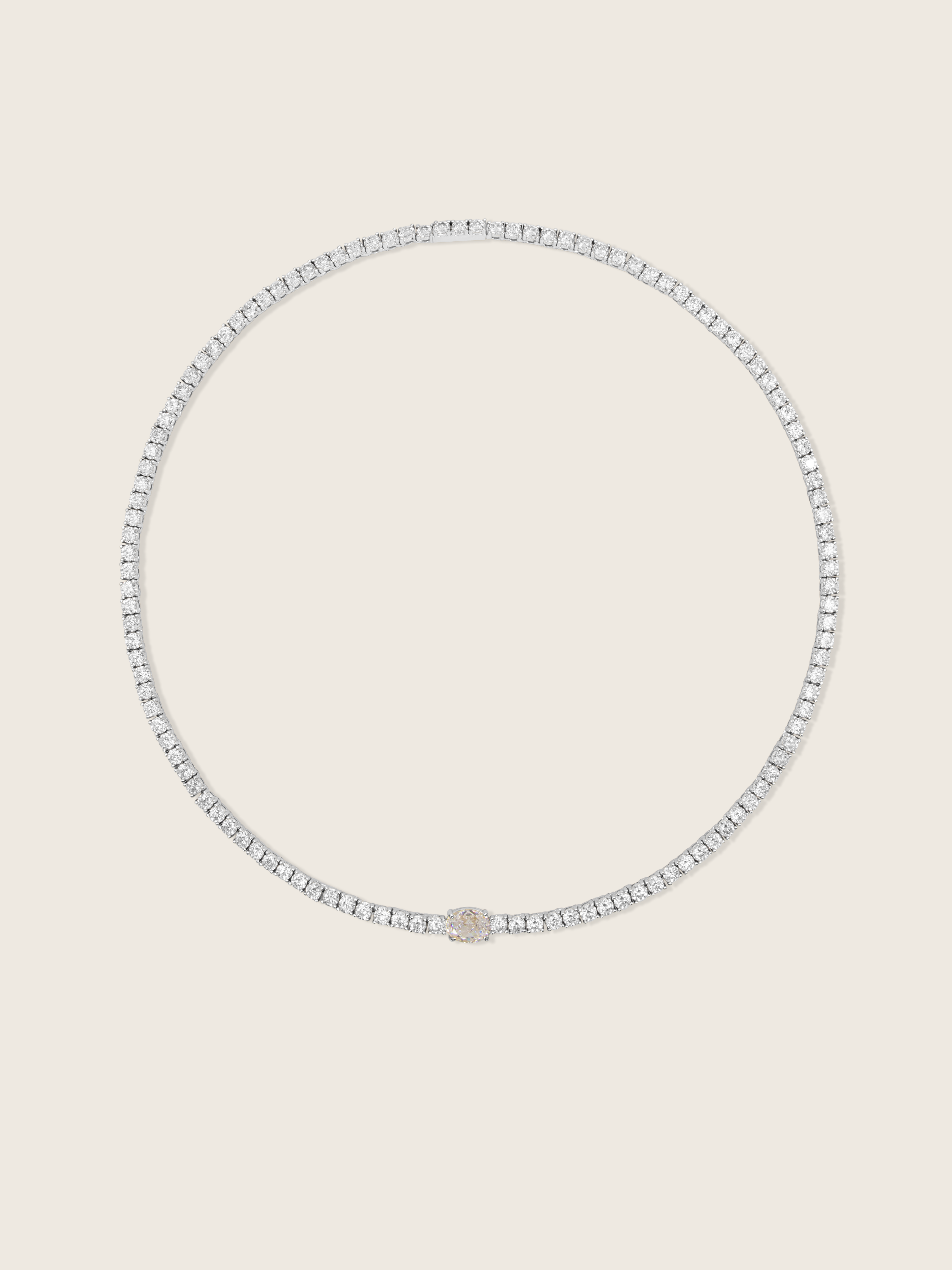 White gold plated tennis necklace with clear CZ stones and central oval-cut detail