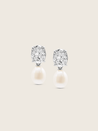 Aurelia earrings with oval clear CZ stones and freshwater pearl drops in premium white gold plating, displayed on a neutral background