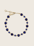 Clarissa Bracelet in 14k gold plating with deep blue cubic zirconia stones in graduated sizes, displayed on neutral background