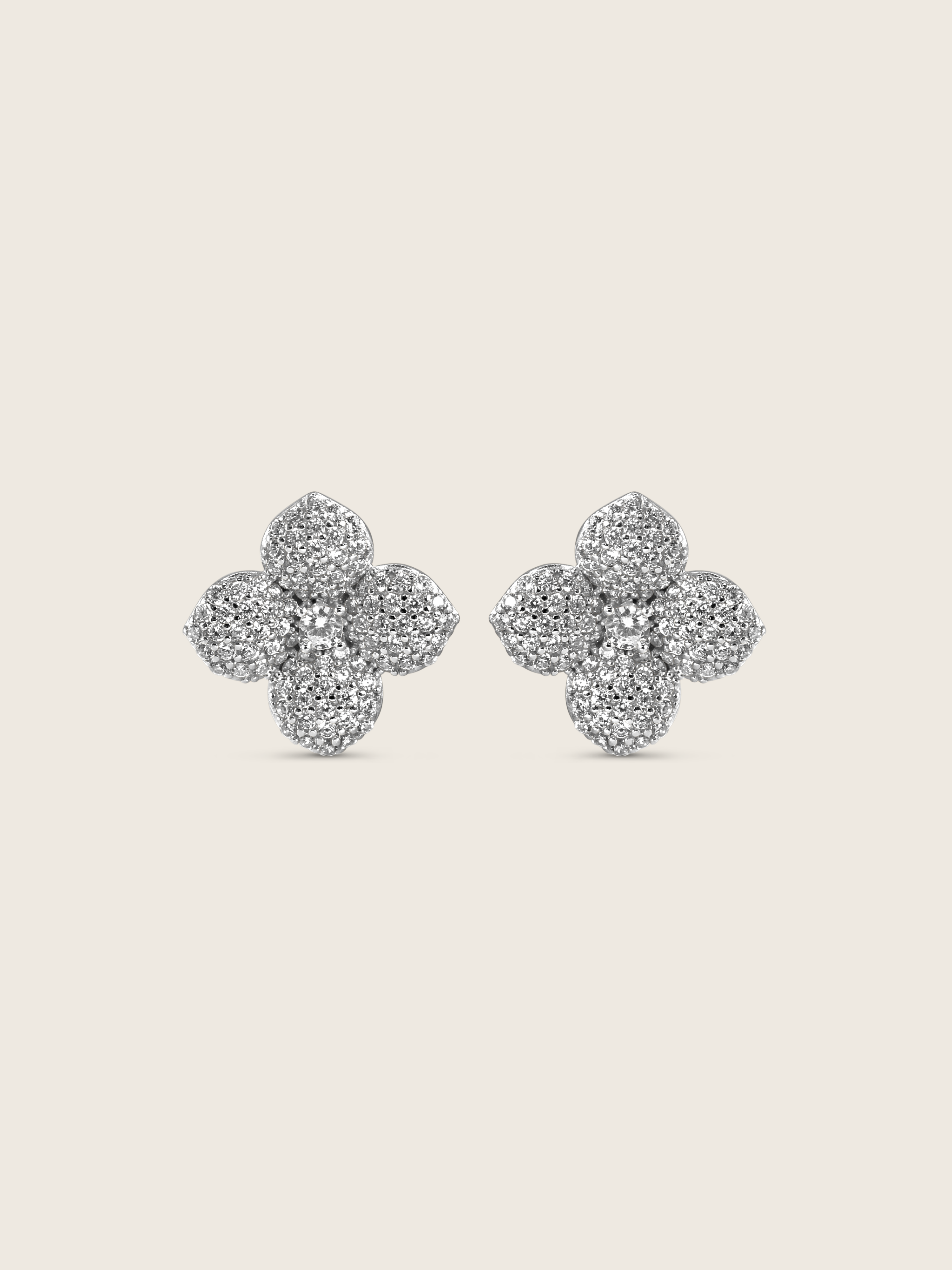 Classic Hydrangea stud earrings in sterling silver with white gold plating, featuring a bold floral design with clear cubic zirconia stones on each petal and a prominent centre stone, elegant statement studs displayed on a white background.