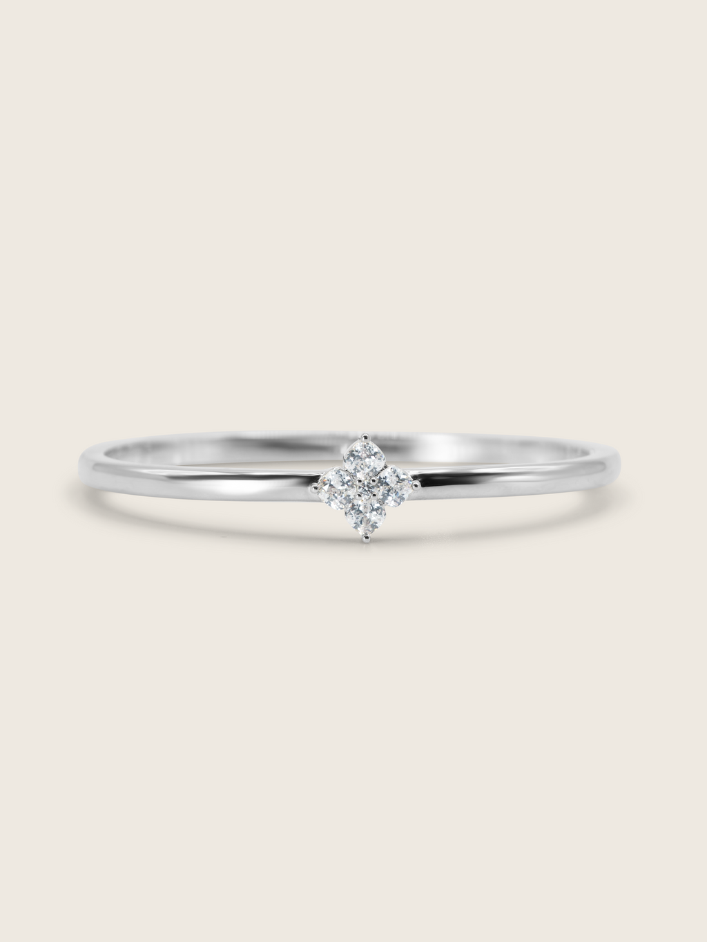 Front view of the Crystal Hydrangea Bangle featuring a sparkling hydrangea stone, set on a sterling silver white gold-plated bangle, against a clean white background.