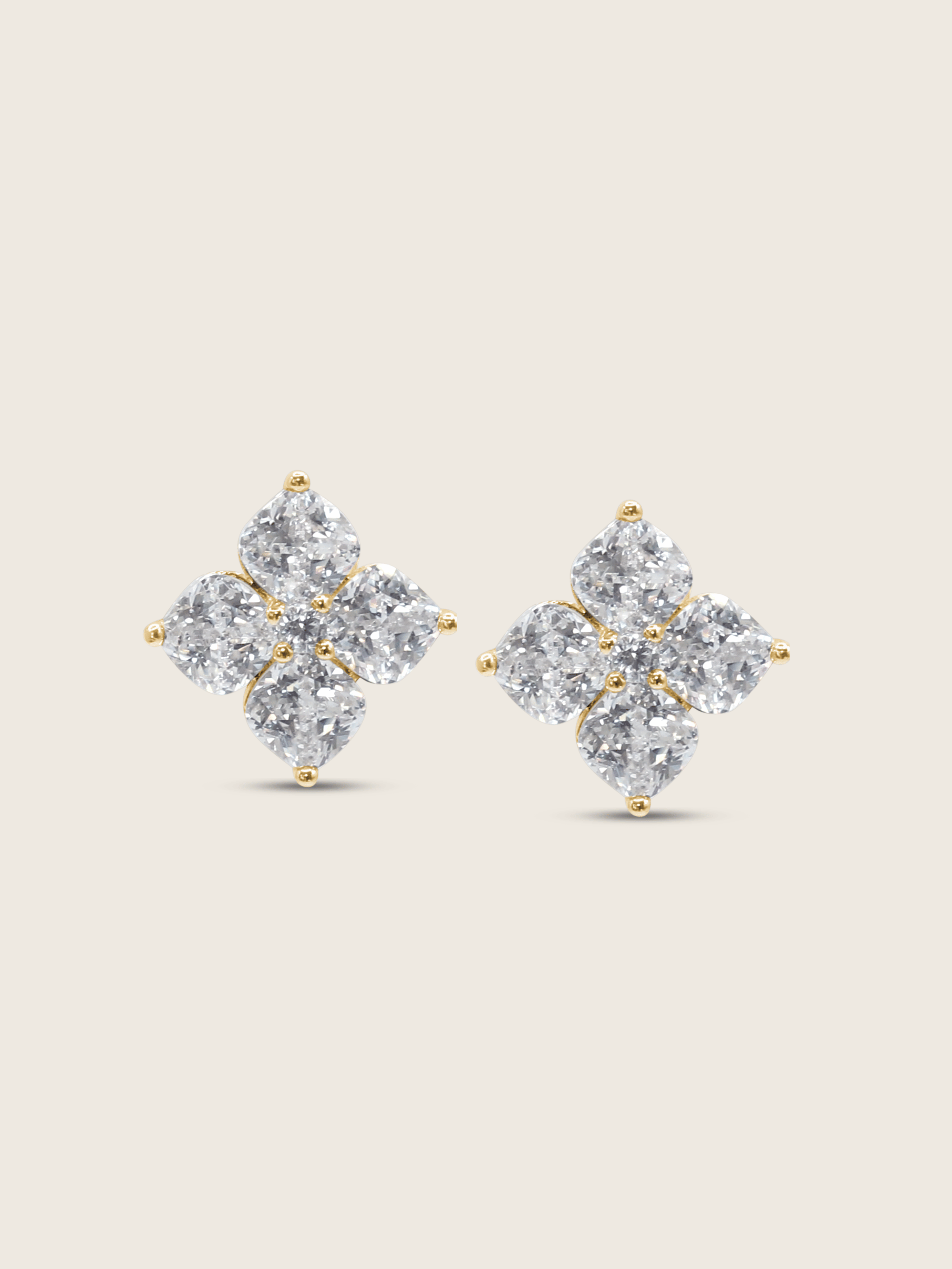 The Crystal Hydrangea Stud Earrings featuring individually cut CZ stones arranged in a floral design, set in sterling silver with gold plating, displayed on a clean white background.