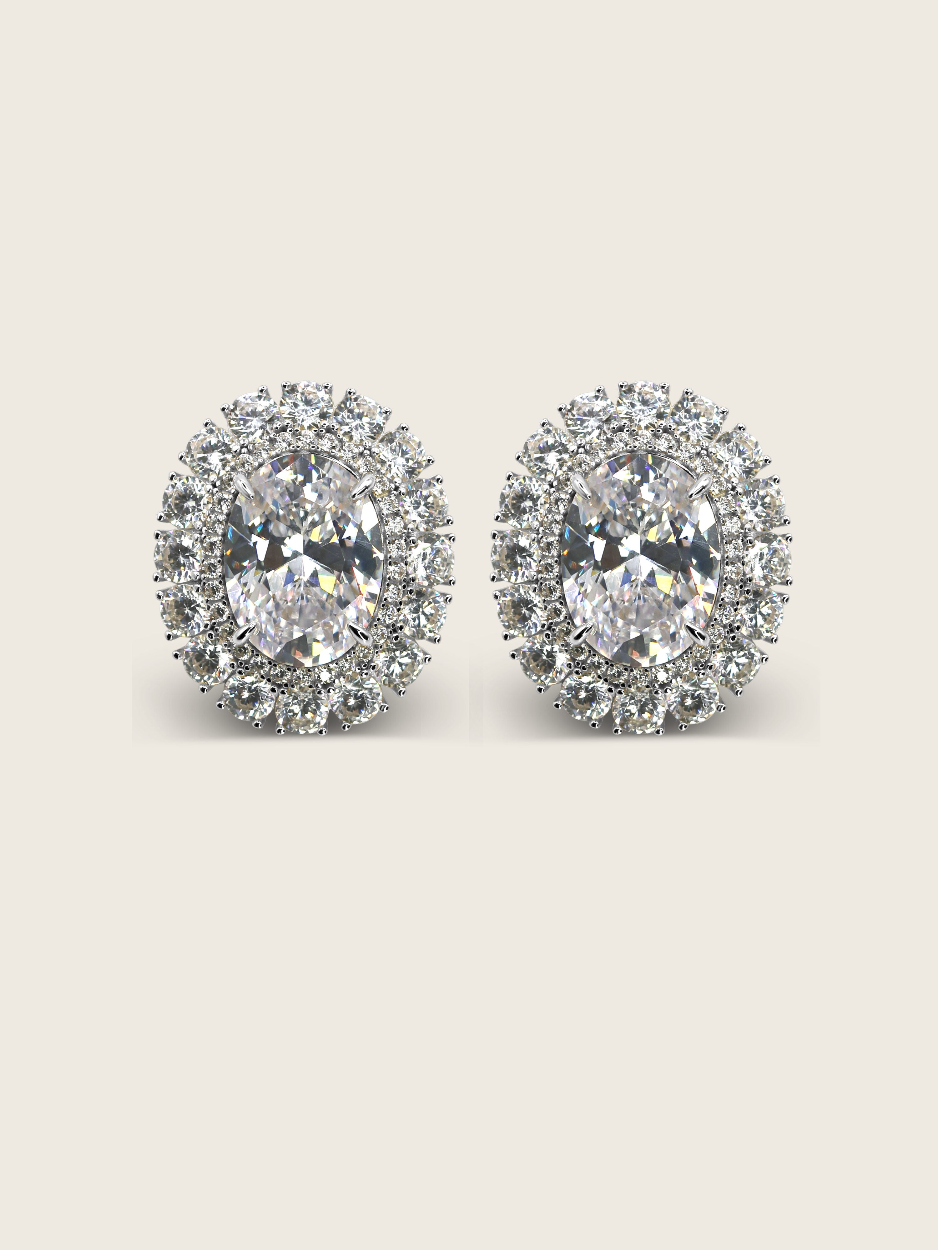 Diana earrings with clear crystal cubic zirconia in a double halo oval design with premium White Gold plating