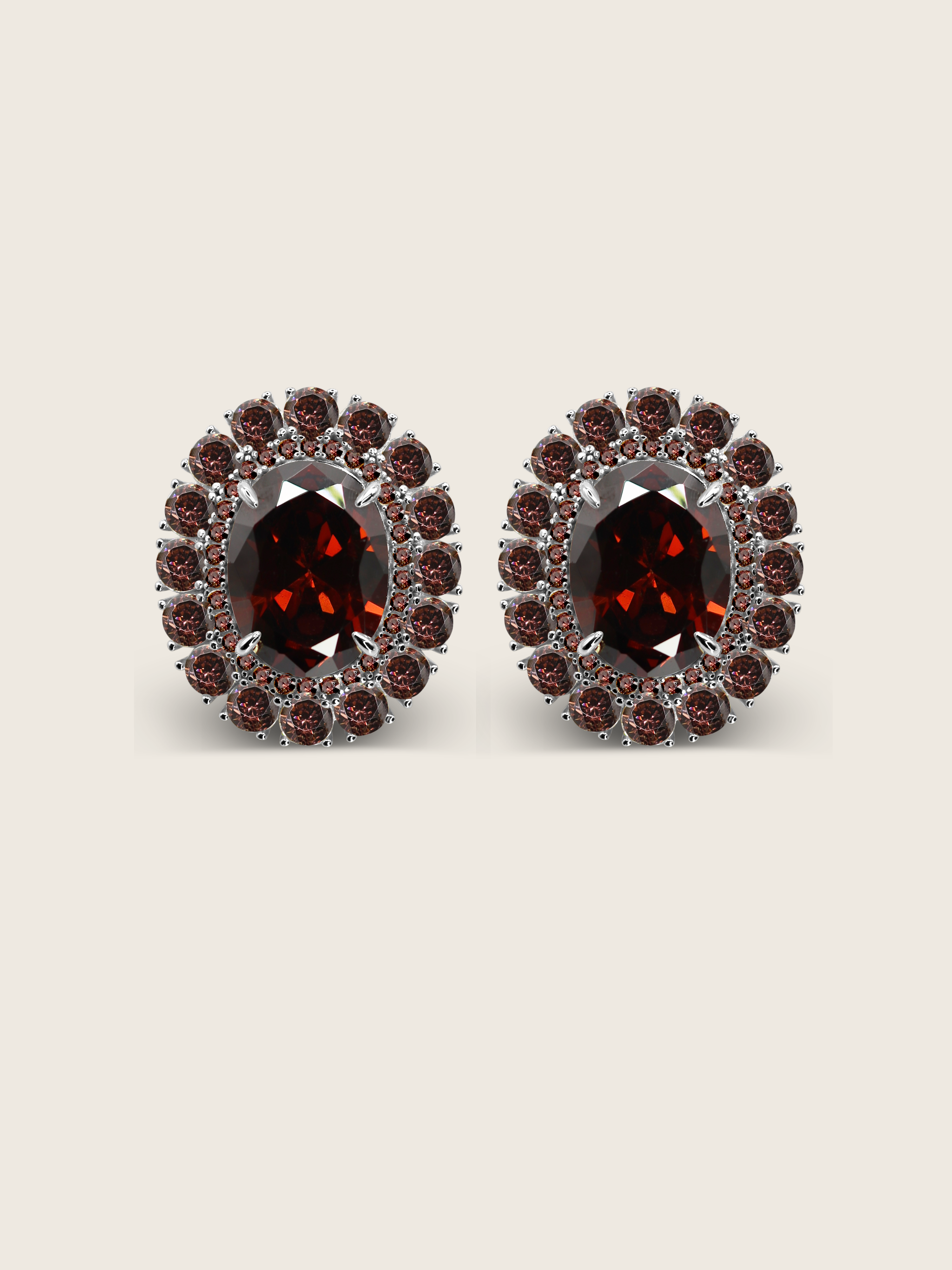 Diana earrings in premium white gold with deep wine coloured oval centre stone and halo of cubic zirconia