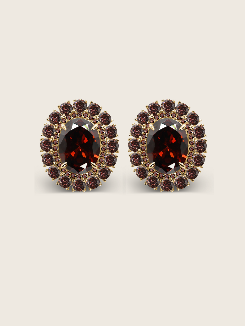 Diana earrings with wine cubic zirconia stones set in an oval gold frame, shown on a neutral background