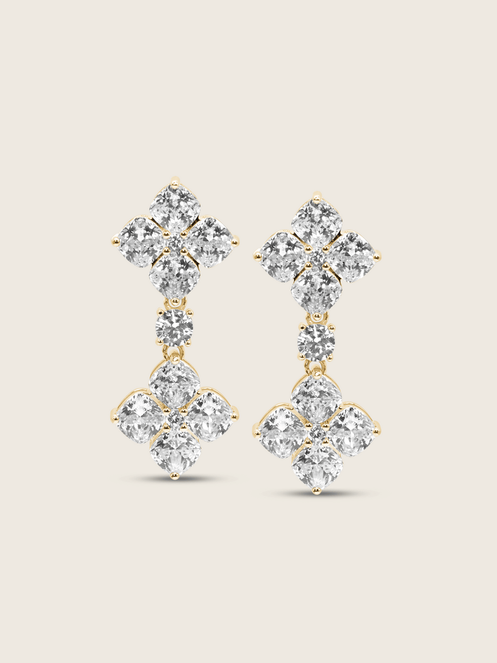 The Double Crystal Drop Hydrangea Earrings featuring two sparkling CZ stones linked by a delicate connecting stone, set in sterling silver with gold plating, displayed on a clean white background.