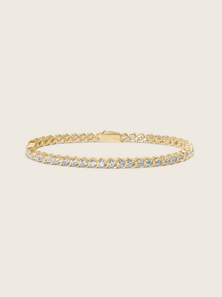 Estelle tennis bracelet in 14k gold plating with cubic zirconia stones, classic S-link design