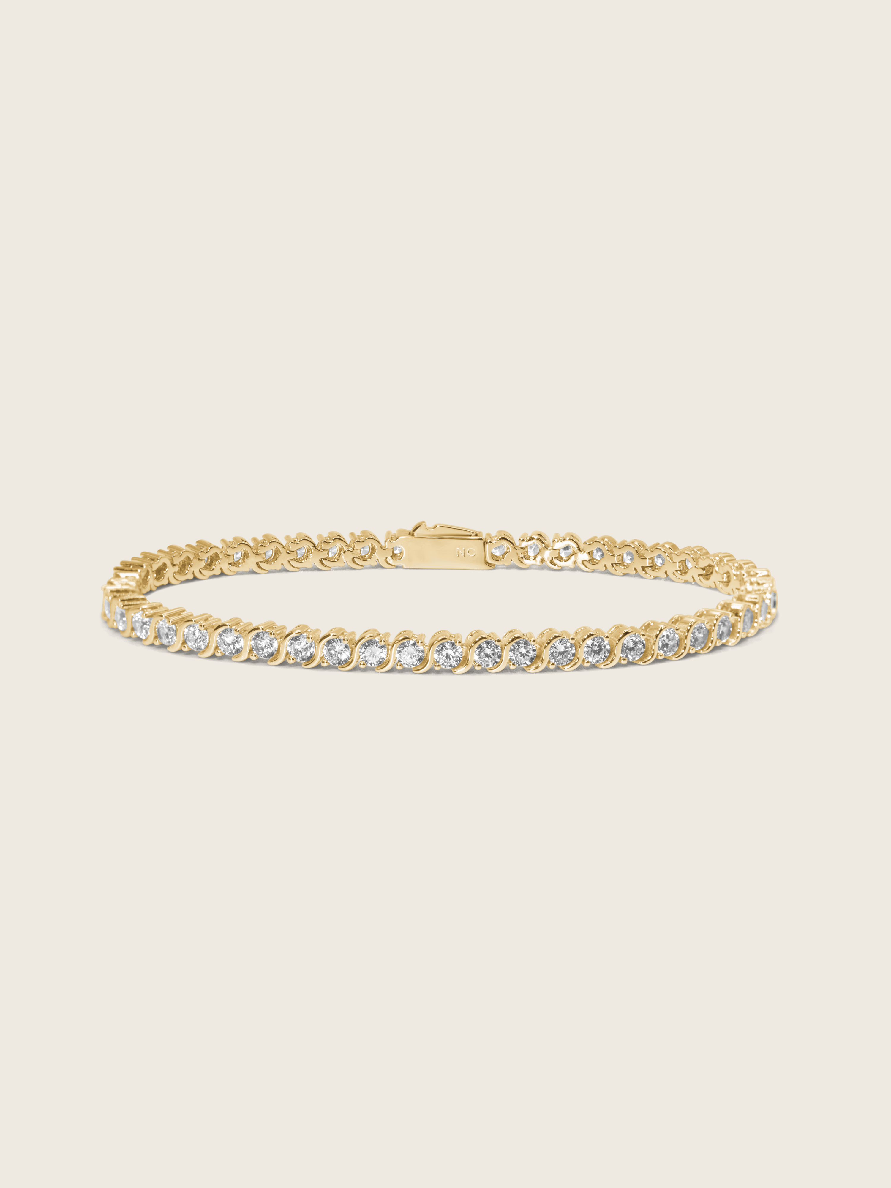 Estelle tennis bracelet in 14k gold plating with cubic zirconia stones, classic S-link design