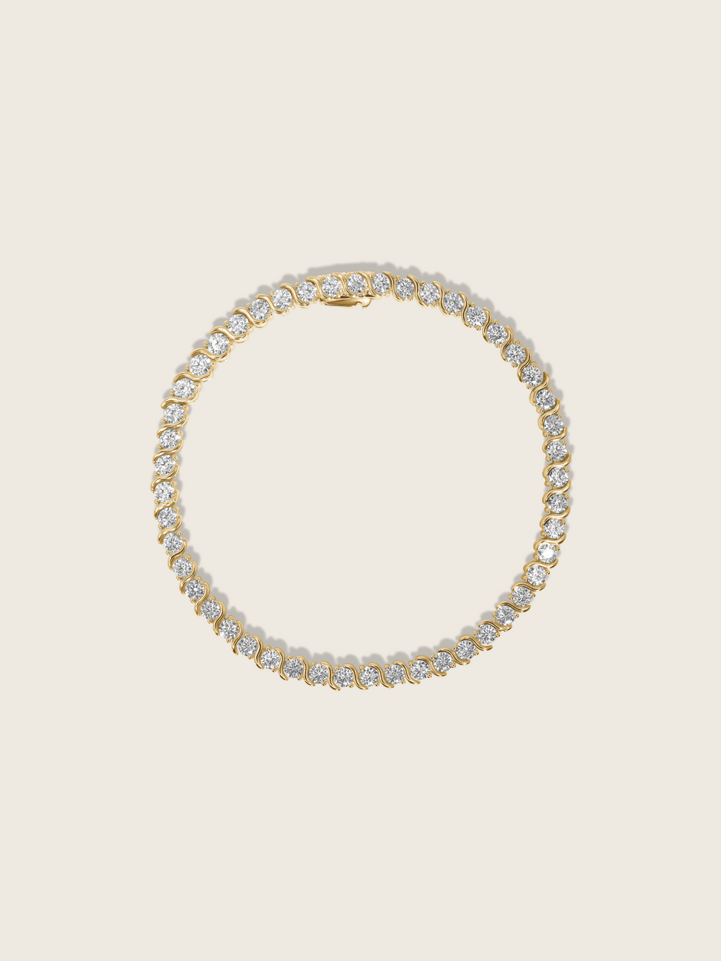 Estelle tennis bracelet 14k gold plated with cubic zirconia stones in S-link chain, circular flatlay